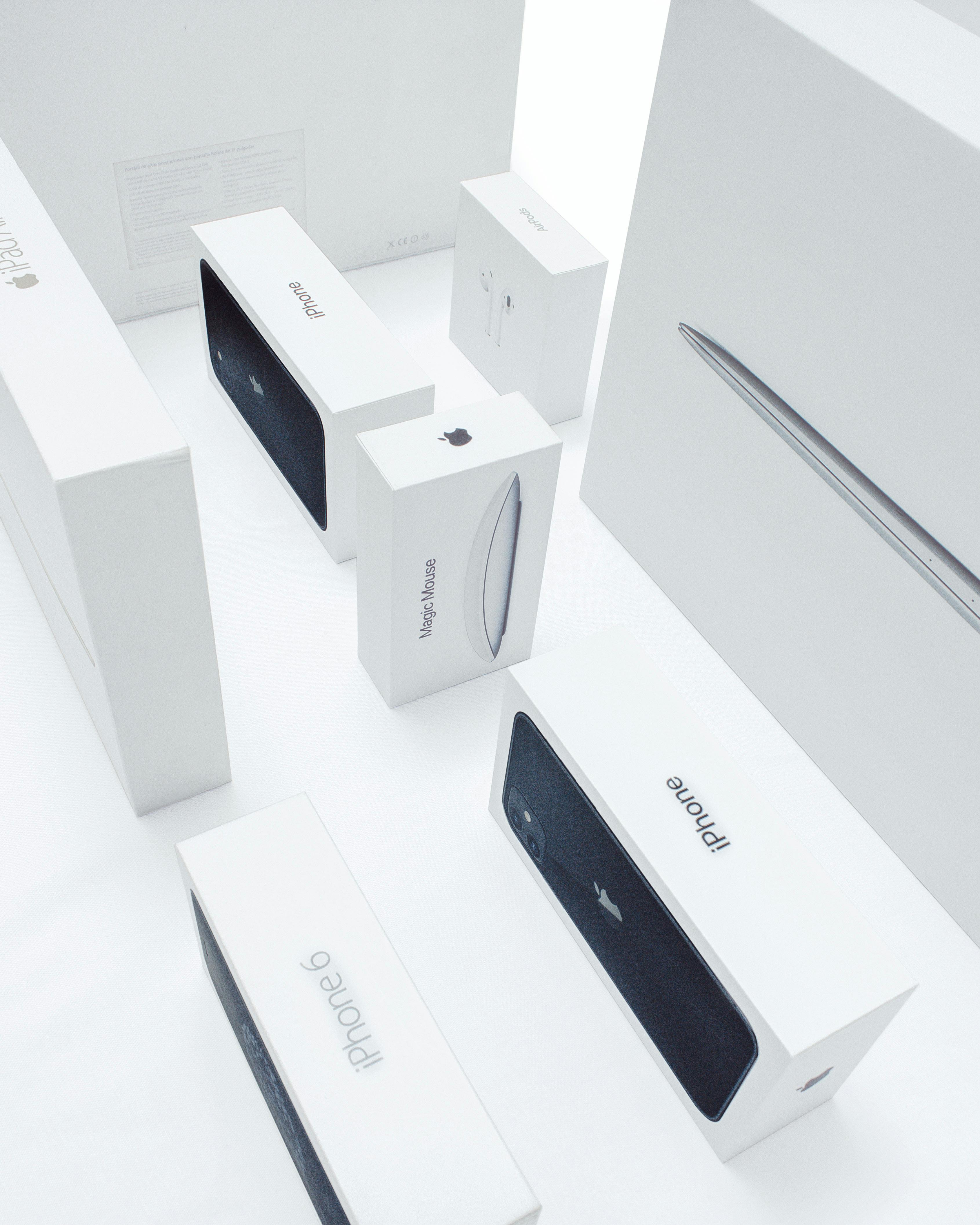 Aerial view of various Apple product boxes showcasing sleek design and branding.